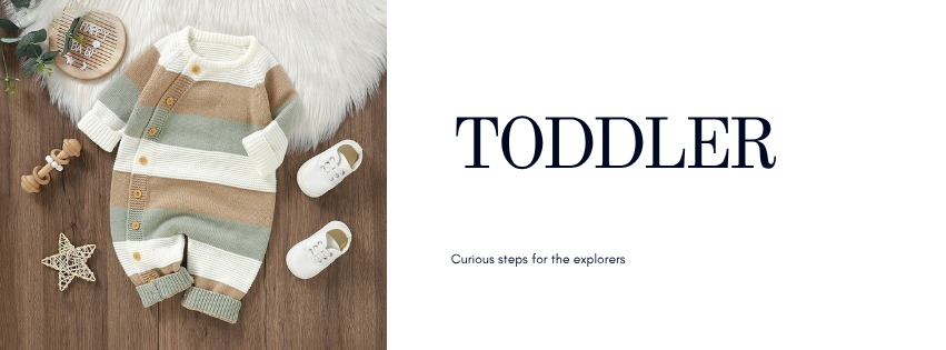Toddler age banner with knitted romper flat-lay on sheepskin